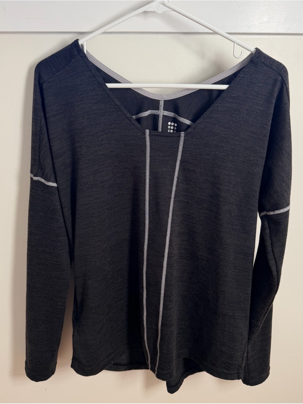 Title Nine Black V-neck Pullover with White Logo. Small side zipper pocket.